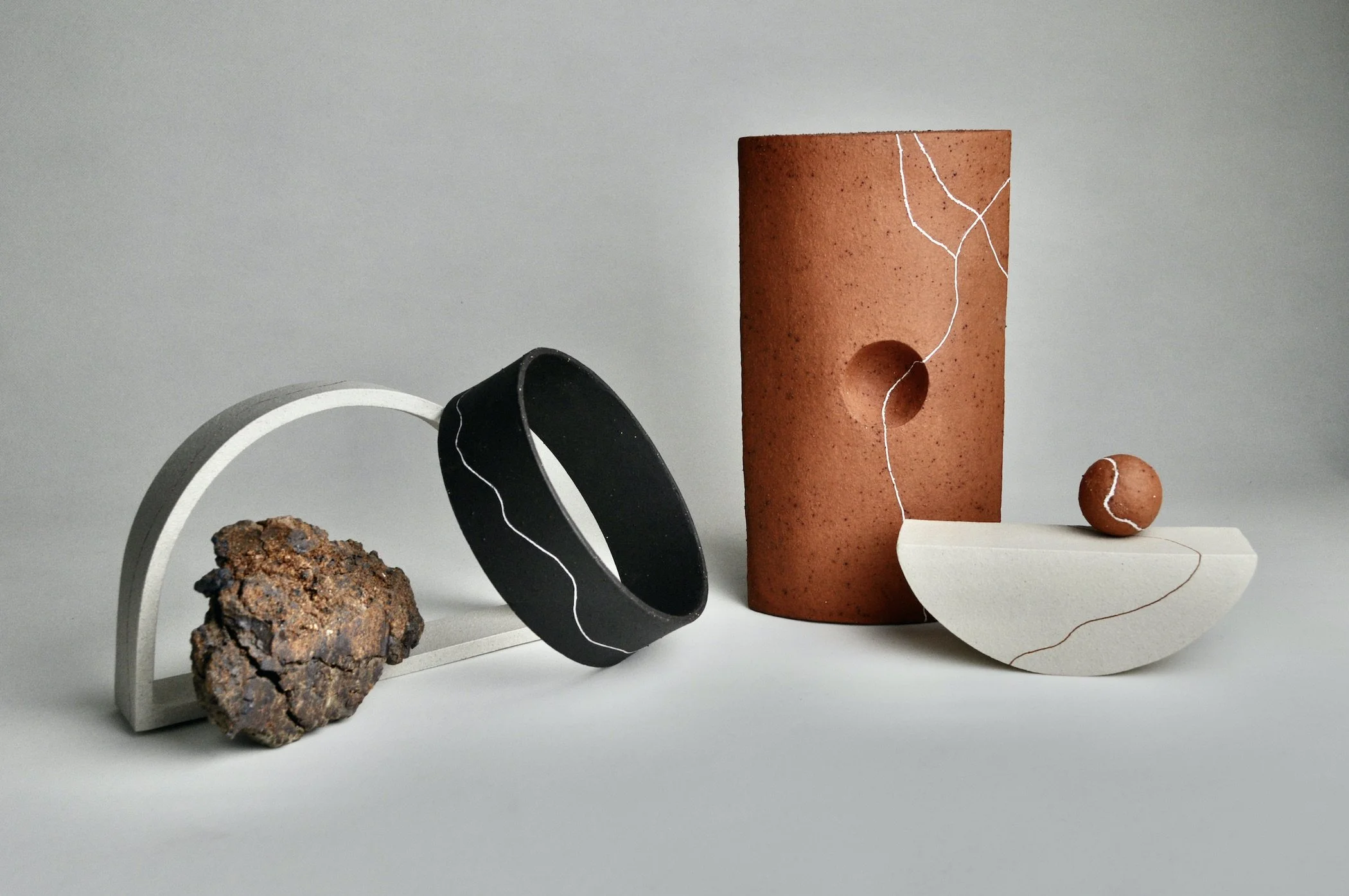   Interloper   2022, 26cm H x 53cm W x 22cm D, white raku clay, black clay, BRT &amp; found clay slip with slip inlays and unrefined found clay  