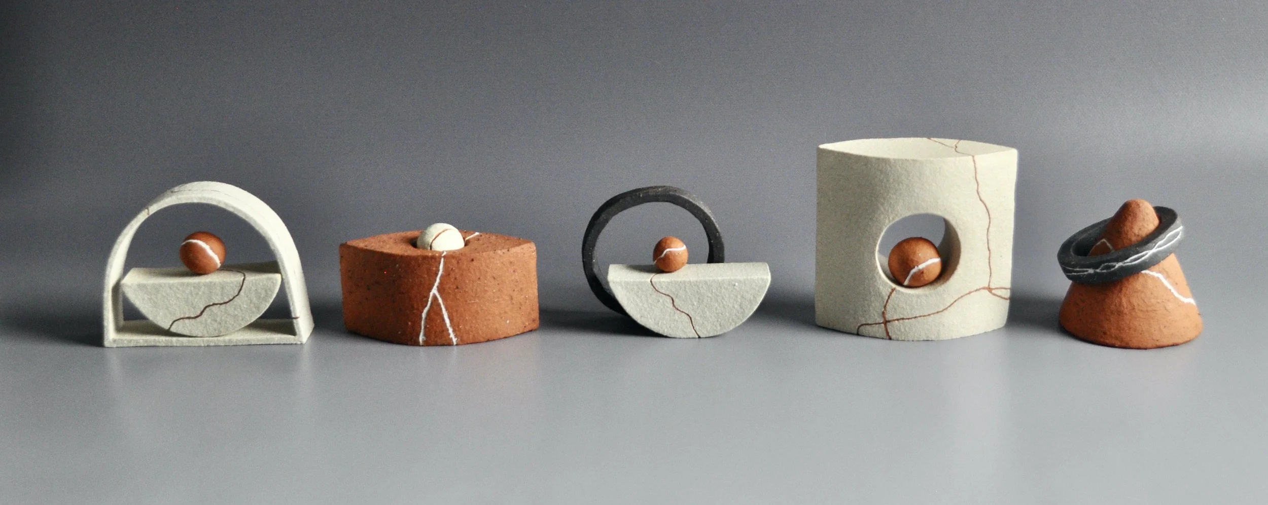   Small Compositions  2022, sizes variable (tallest 8cm), white raku clay, black clay, BRT with found clay slip, slip inlays 