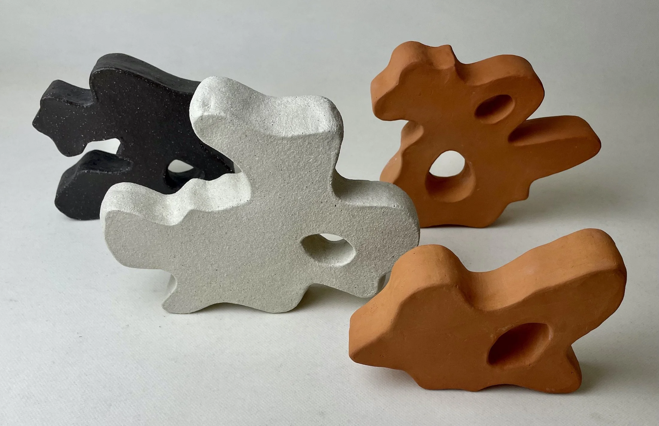  Water reflection group  2025, 16cm H, white raku, dark matter and red earth clay 