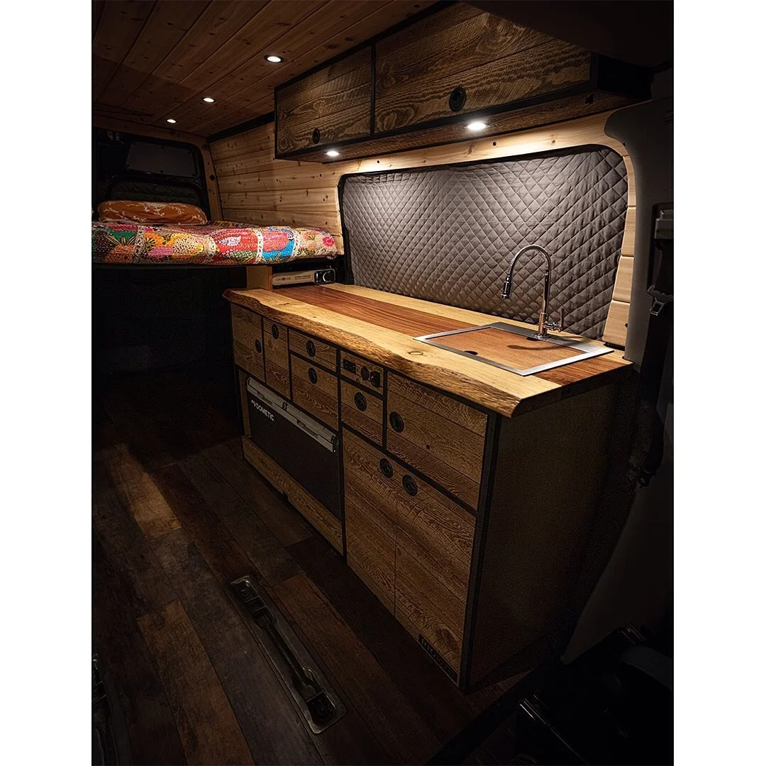 Created a more comfortable and efficient space for "Stevie" and her owner. They wanted to up their cooking game, so we setup em' up with a nice galley, upper cabinets and some Western Red Cedar paneling.  We put the 75l fridge freezer on so