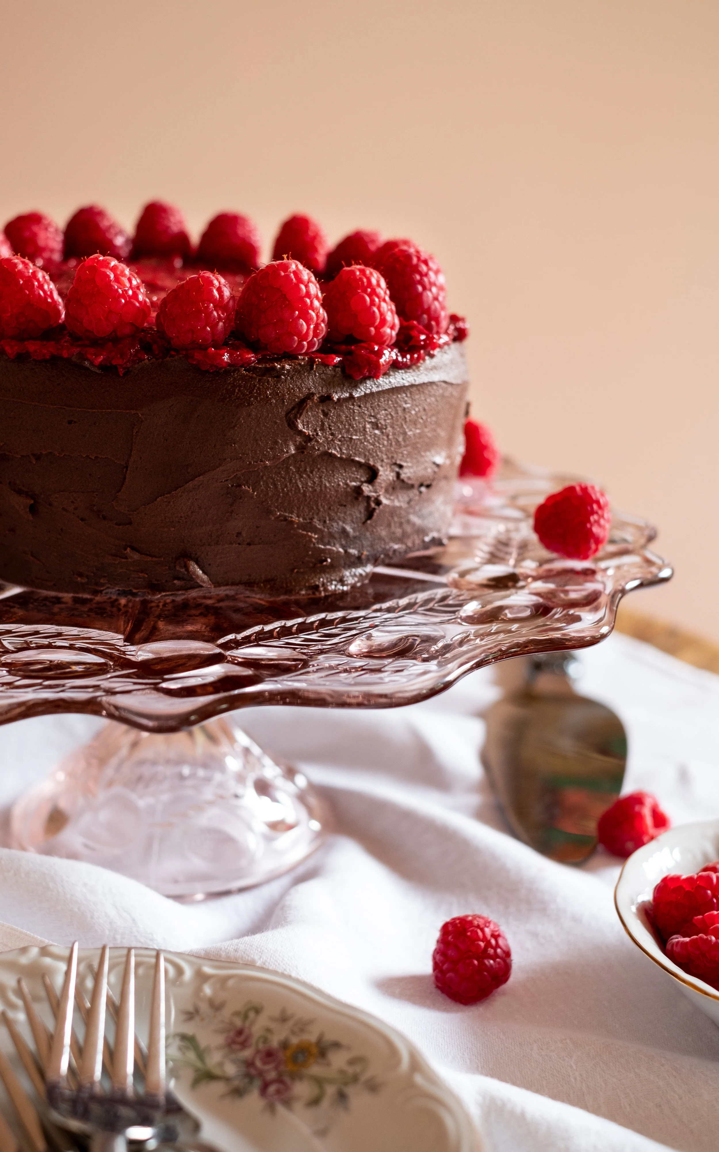 Chocolate layer cake with ganache and mashed raspberries, grain-free, dairy-free and refined sugar-free