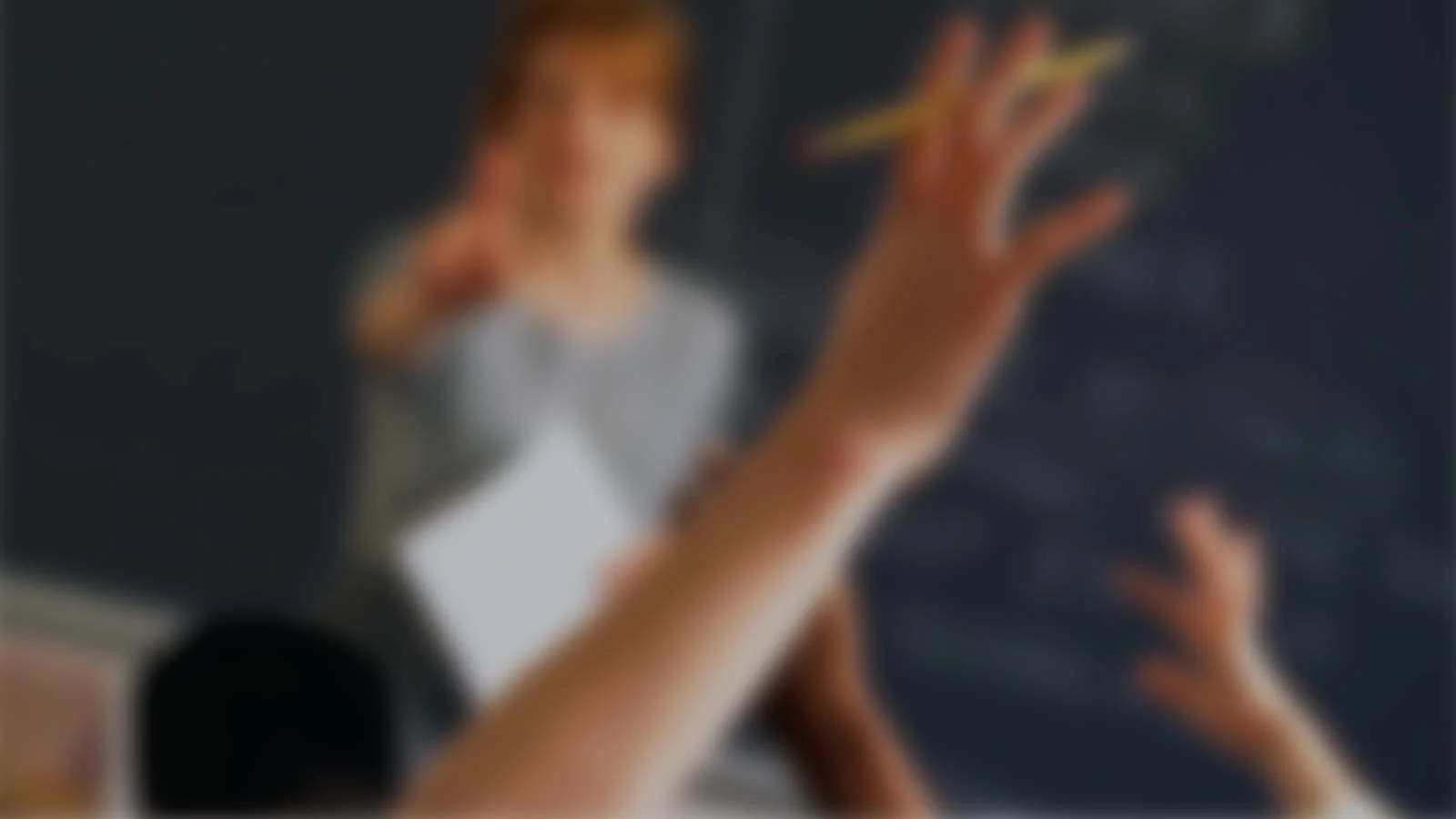 students-with-hands-raised-1.jpg