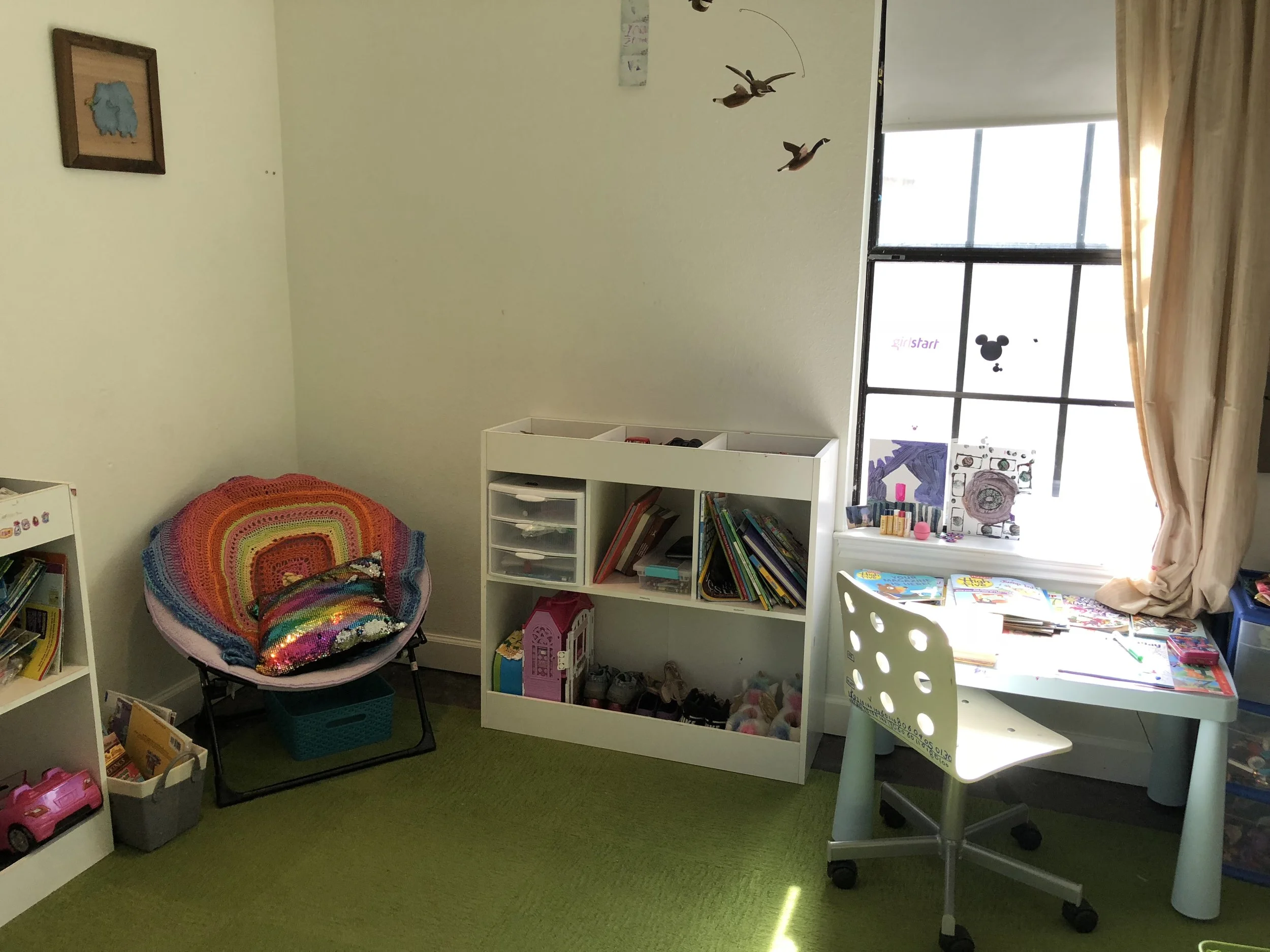 Kid's room after organizing. Nothing new was purchased for this project, we just utilized the existing furniture and storage options, focusing on rearranging and organizing. Plus, we got rid of a lot of stuff.