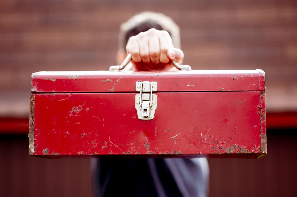 man-holding-toolbox-shutterstock_1880771734 compressed.jpg