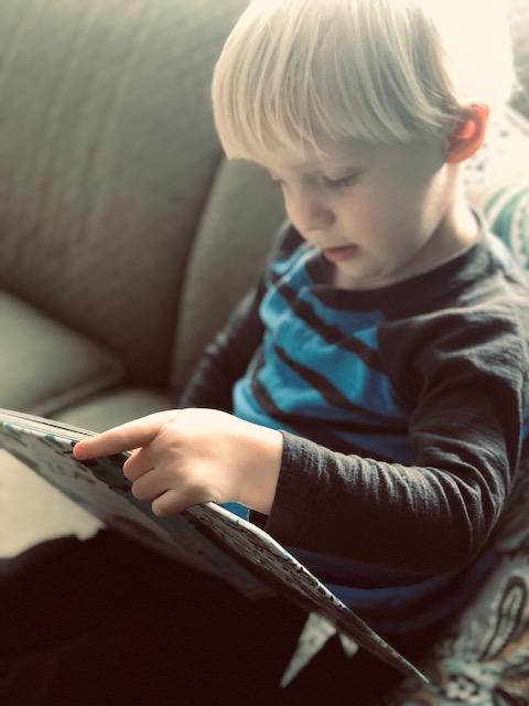 My son Luke reading an Usborne book