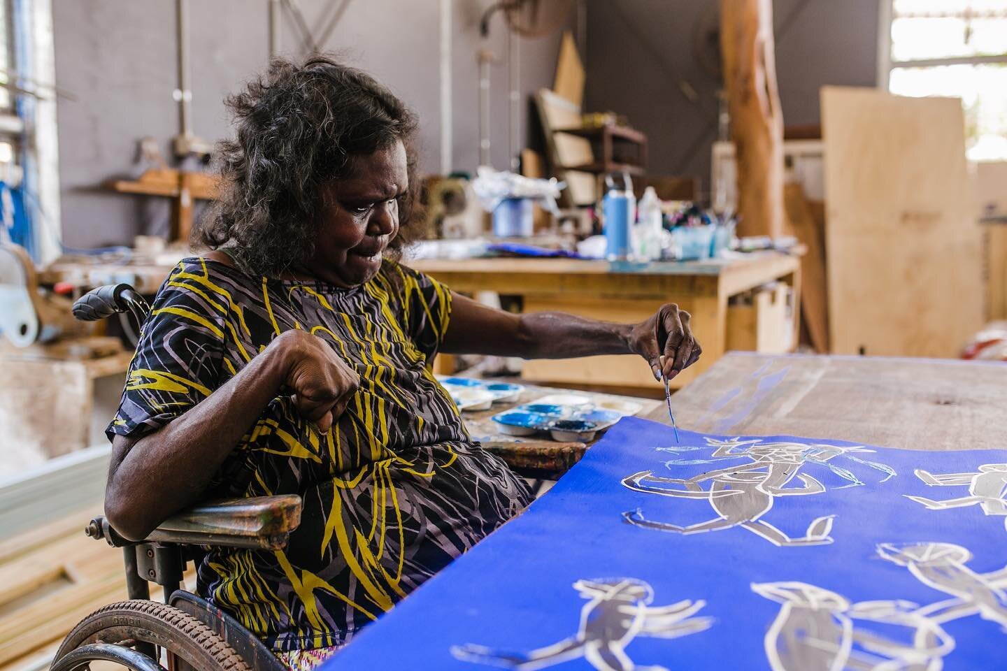 Yolŋu artist Dhambit Mununggurr in the midst of her creative process within @bukuartnow , as photographed for the #ngvtriennial. What an honor to capture this dynamic wulgaman rendering her ancestral stories and her own contemporary narratives.