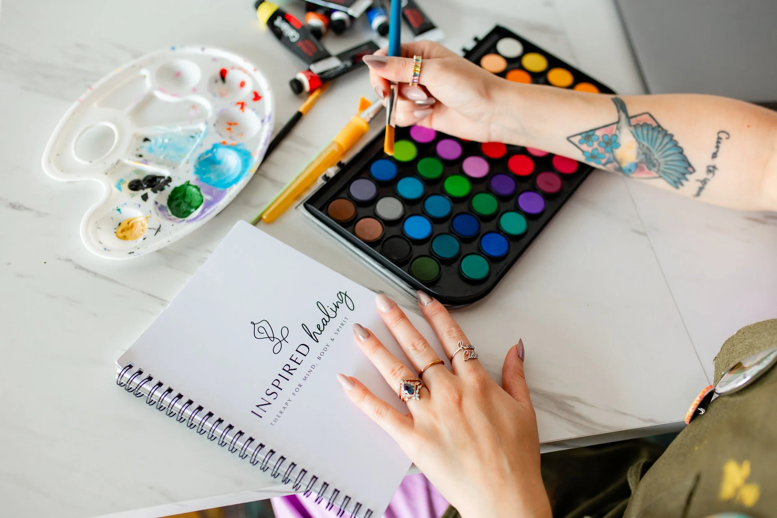 Woman painting for relaxation as a part of art therapy in Royal Oak, MI. Begin your art therapy for self discovery and self esteem with a holistic therapist whether you are in Royal Oak or Detroit, MI.