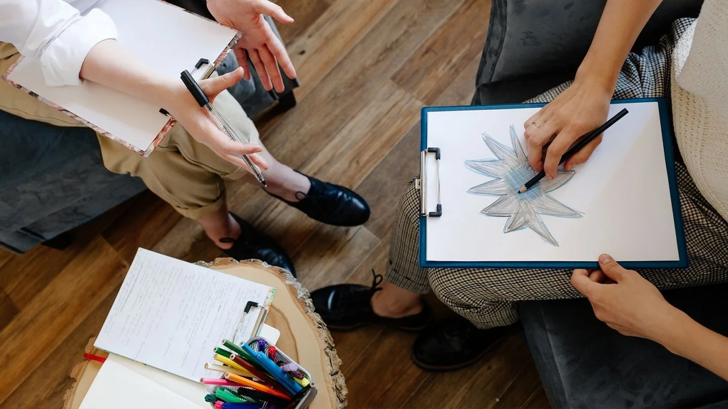 art therapy session with a client utilizing art supplies