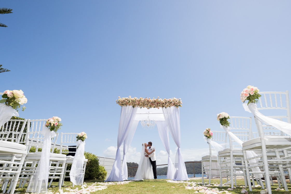 Ceremony- 4 post canopy, pew ends, rose petals.jpg