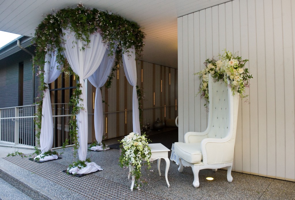 Round canopy with white chiffon with jasmine florals, King chair and white vintage table - Image 2.jpg
