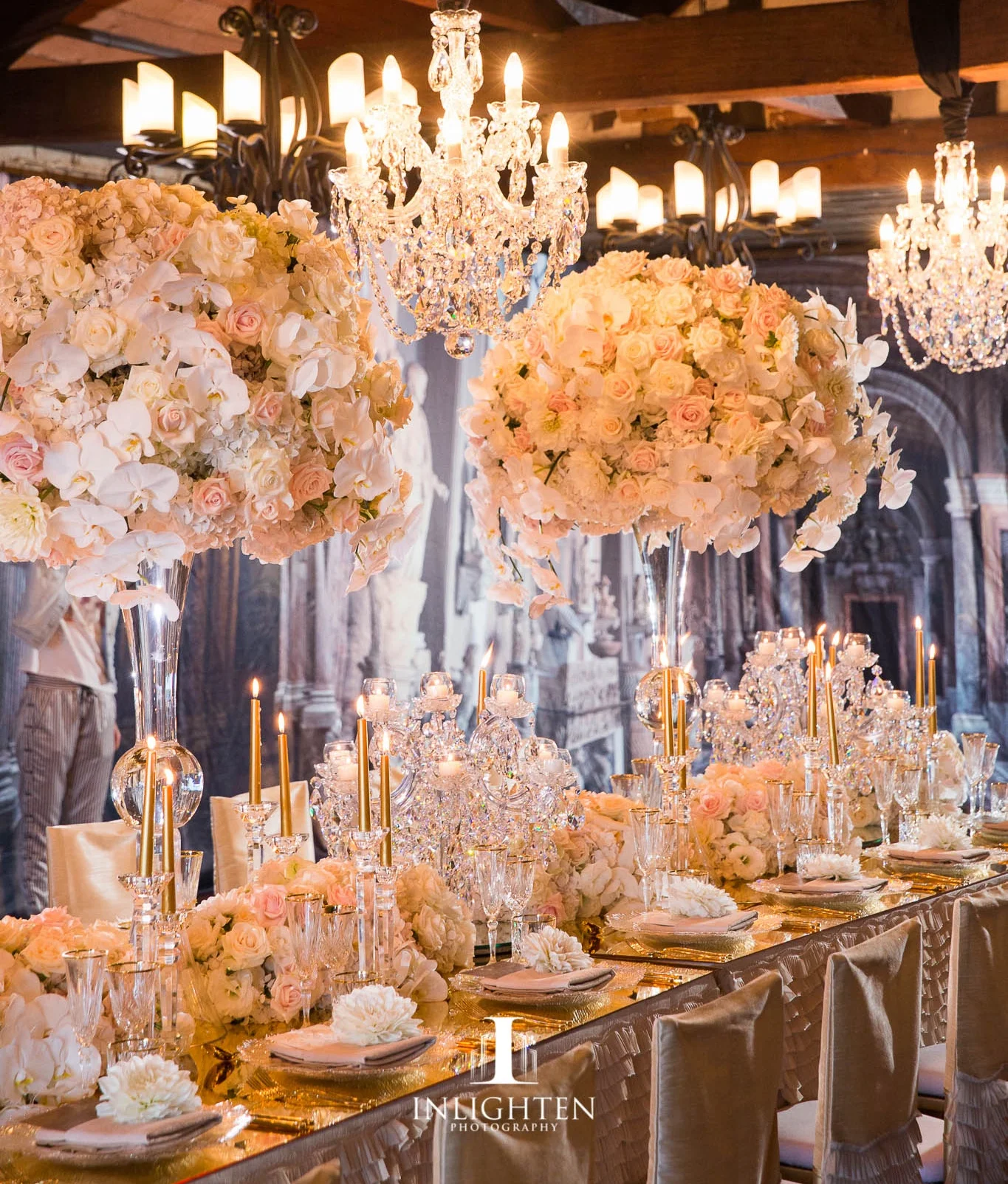 luxury linen_crystal chandelier_ centrepeice_ gold candles_crystal candleabra_champagne chair covers_crystal glasswear_crystal vase.jpg