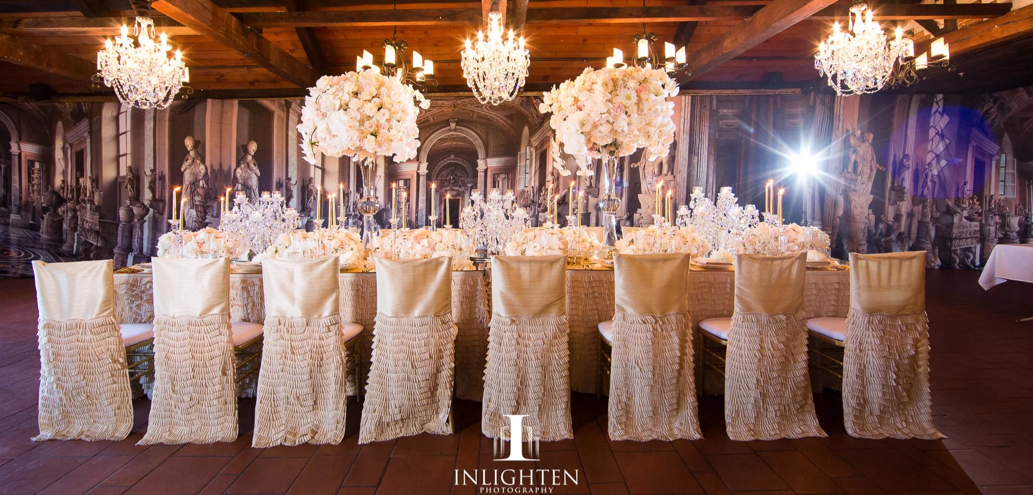 Champagne chaircovers_centrepiece_crystal chandeliers_italian inspired backdrop.jpg