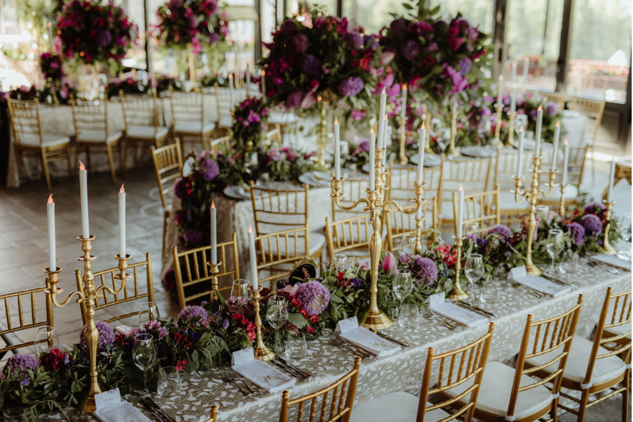 gold_candleabra_purple_floral_runner_gold_candlesticks_LED_candles_napkins_monogram_centrepiece.png