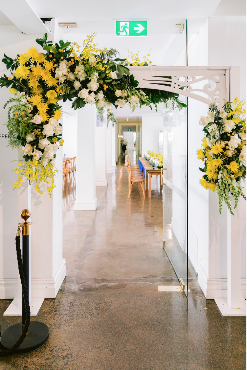 Special_event_activation_event_decor_event activation_positano_theme_archway_flowers_yellow_white_greenary .png
