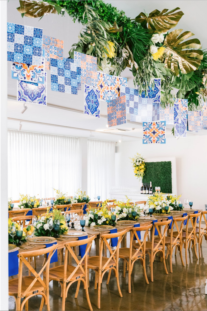Special_event_activation_event_decor_event activation_positano_theme_setup_king_tables_hanging_tiles.png