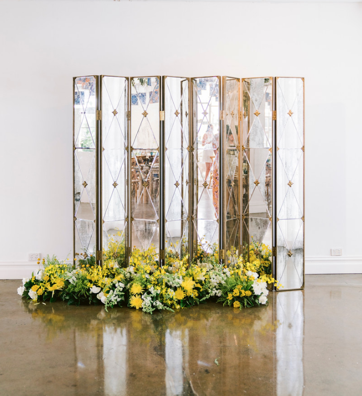 Special_event_activation_event_decor_event activation_positano_theme_yellow_white_flowers_gold_backdrop.png