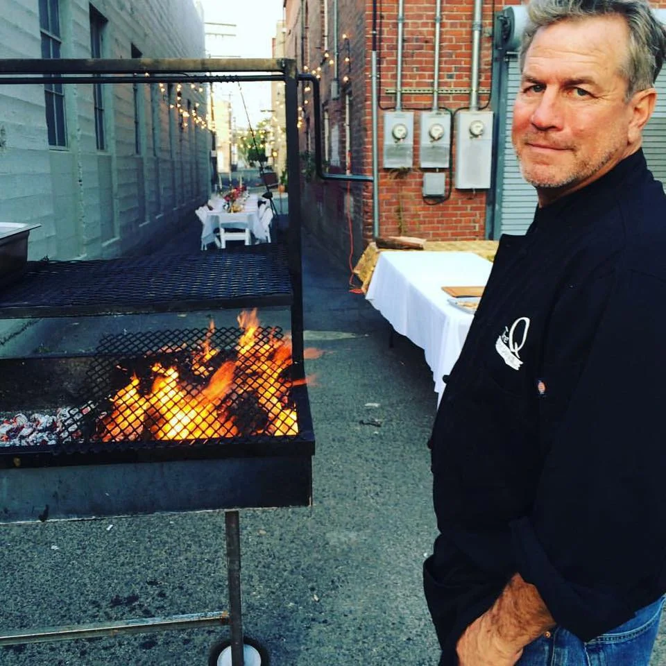 Emry firing up the grill for Dama’s Alley Dinner