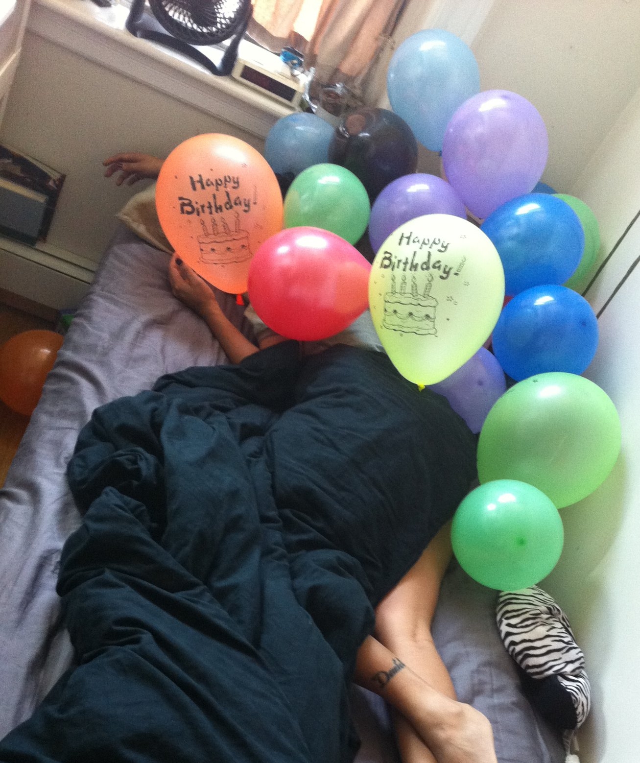 Roommates surprised me on my birthday by filing my tiny room with balloons.