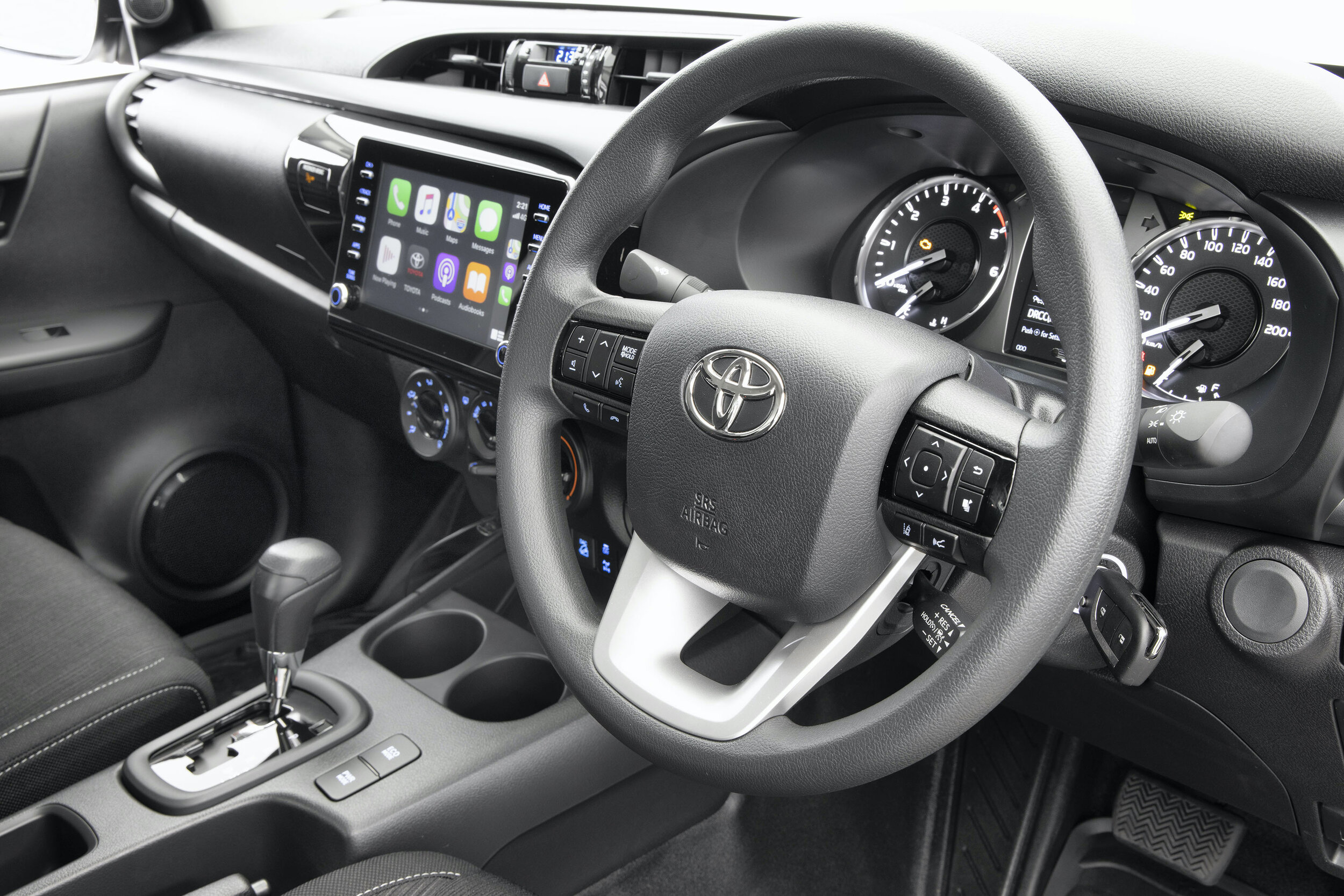 IMAGE_2021 Toyota Hilux, SR Grade double cab wellside, 4WD, Glacier White, steering wheel, apple carplay and key shot.jpg