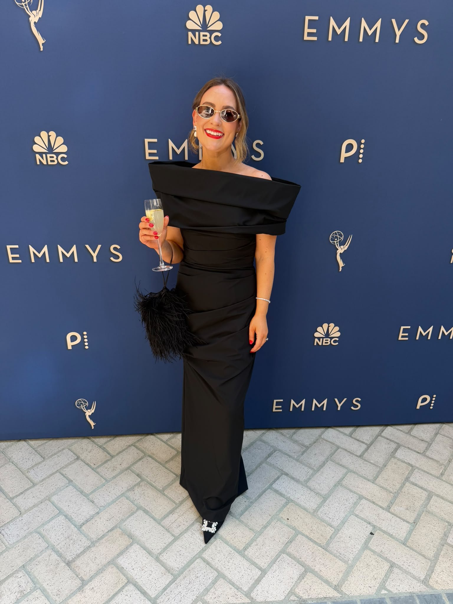L.A. Sun Spray Tan client at the Emmys in Los Angeles wearing a black gown with a natural glowing spray tan.