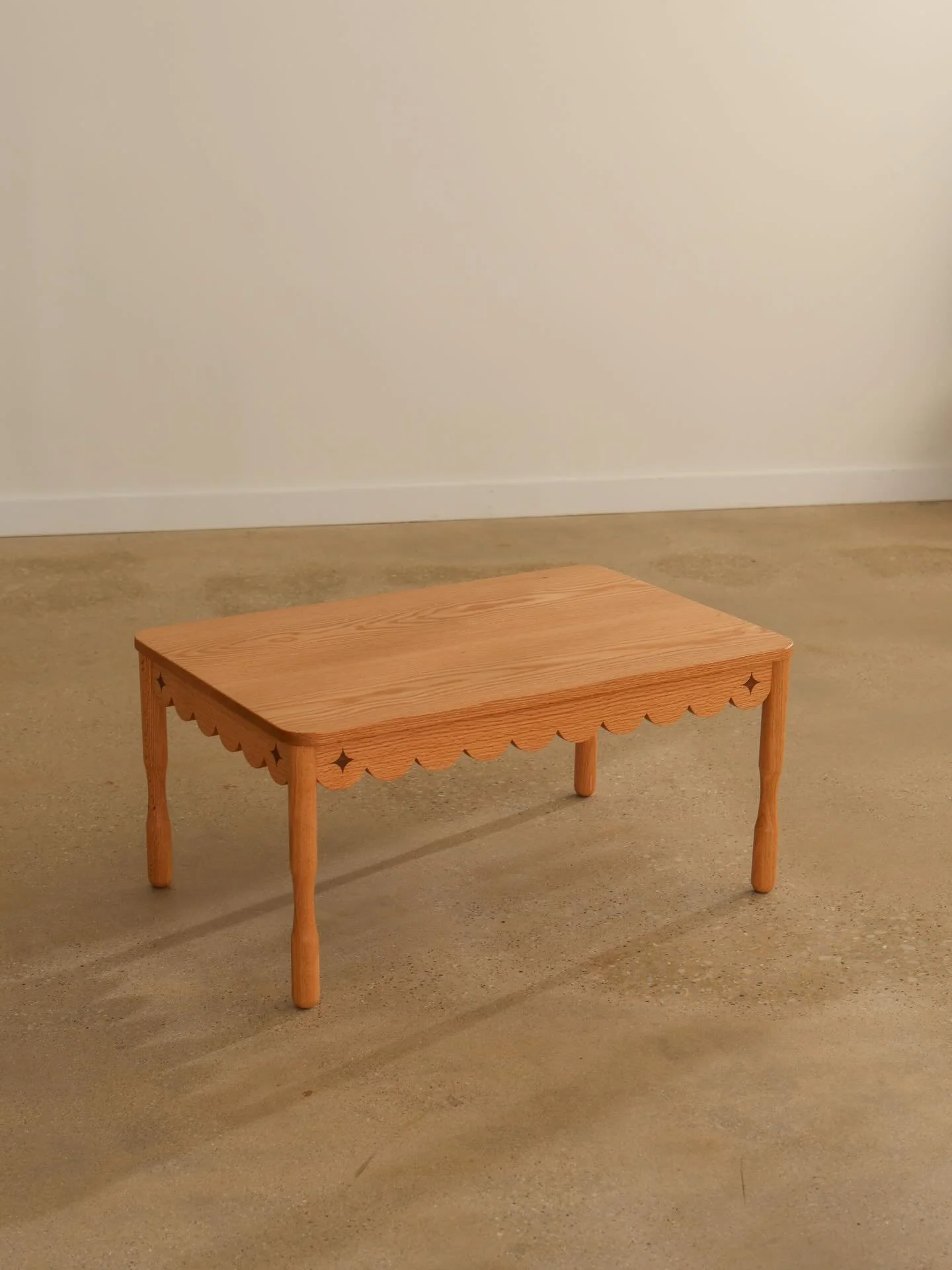 Final chance on the New Design Discount: ODIE10 
Offer ends Dec 25th. 

Solid wood table. Scalloped apron with twinkle inlay. Sculptural hand-turned legs. 

22&rdquo; wide x 33 1/2&rdquo; long x 15 3/4&rdquo; tall