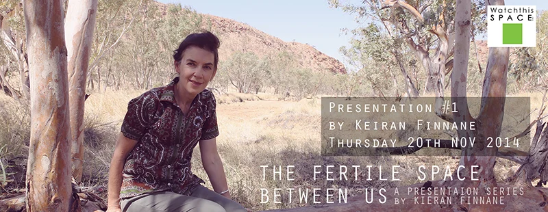 Kieran Finnane sits in the Todd River with Heavitree Gap in the background, Alice Springs, 2014.