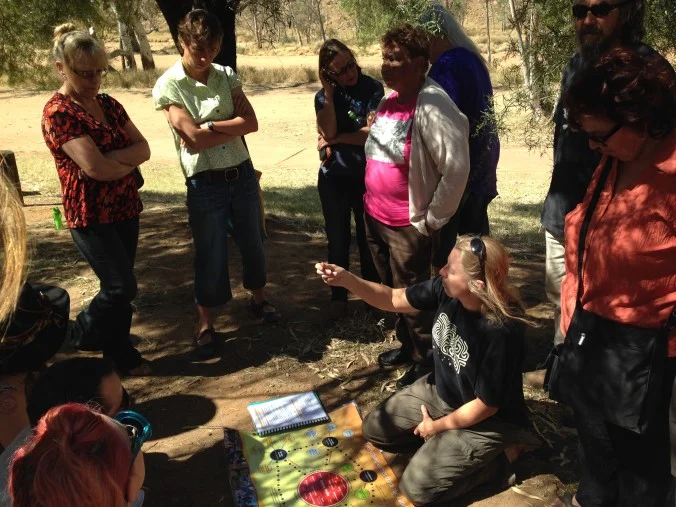 ‘Cultural people’, artist and story-tellers from Alice Springs Desert Festival and Free BBQ Cash Giveaway Festival on the sacred sites tour with Doris Stuart, 2014.