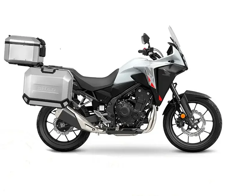 White Honda NX500 with panniers for rent at BSR Bike shop, sider view
