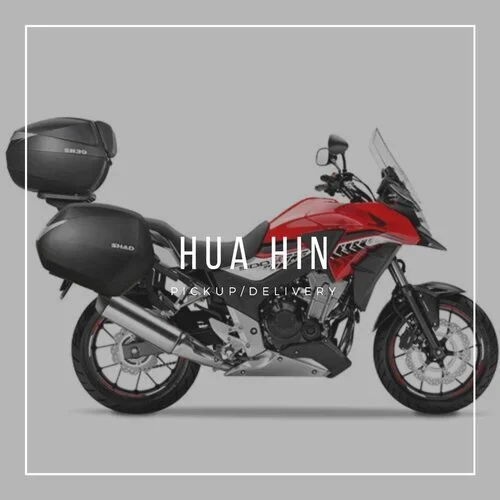 Red CB500X, side view, with Hua Hin written over the top of the image