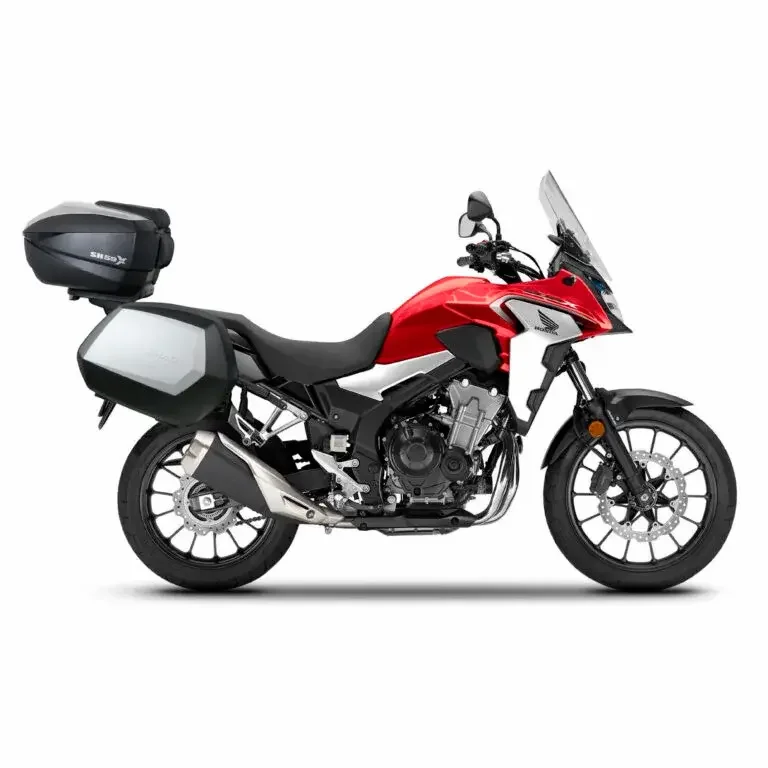 Red and black touring motorcycle with side and top cases.