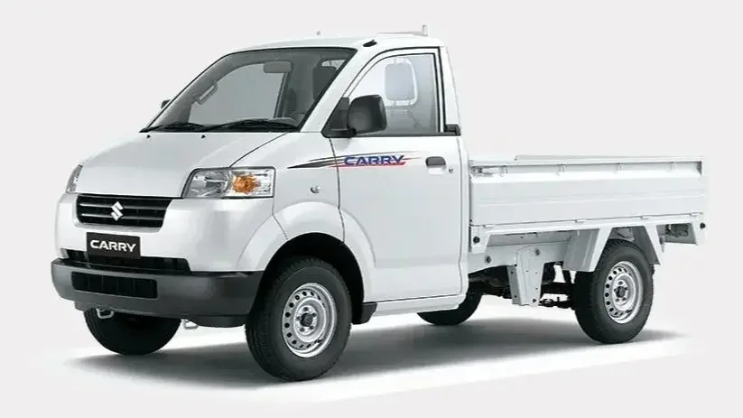 White Suzuki Carry pickup truck with flat bed