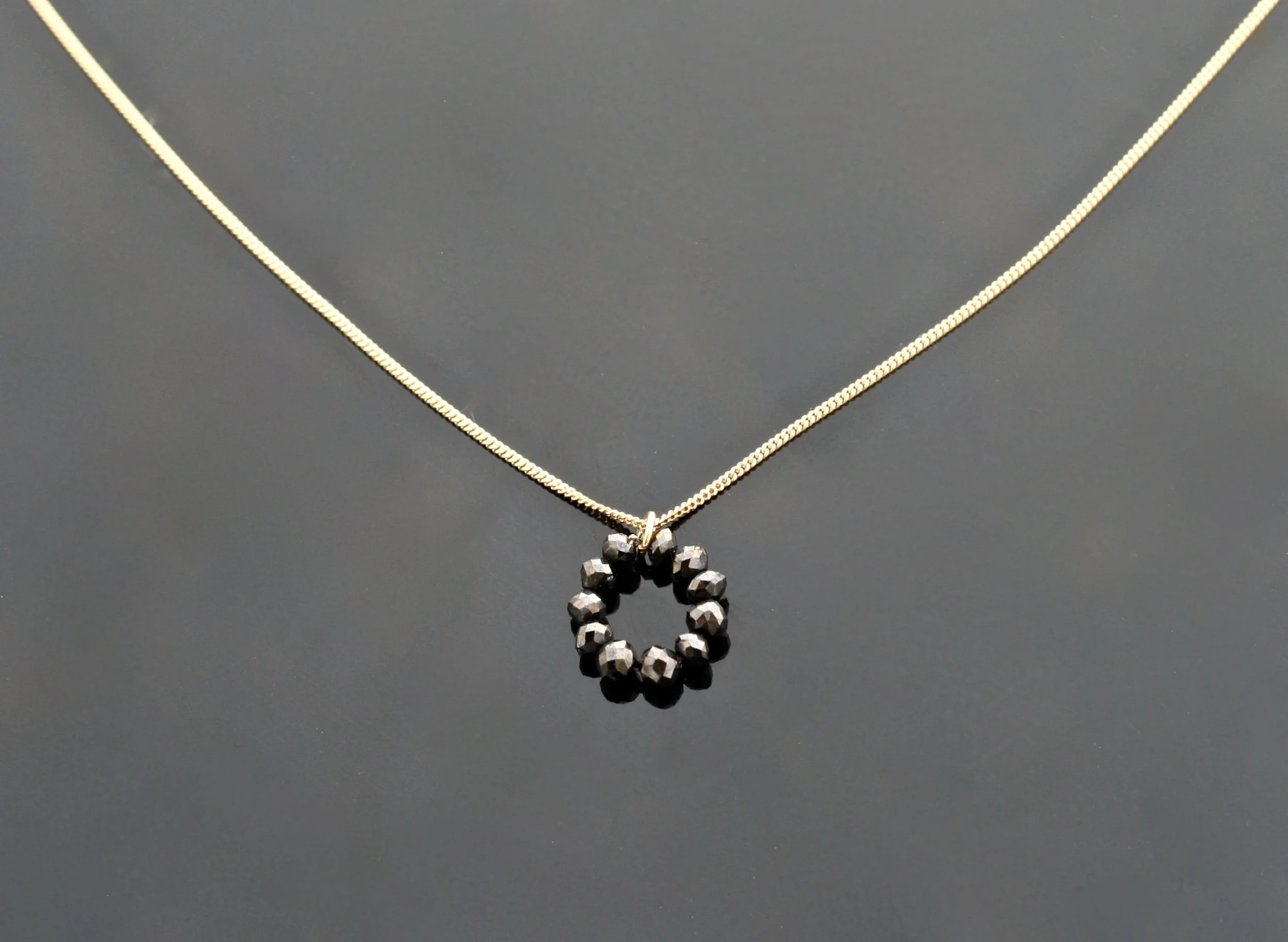 18 carat yellow necklace with black diamond halo drop