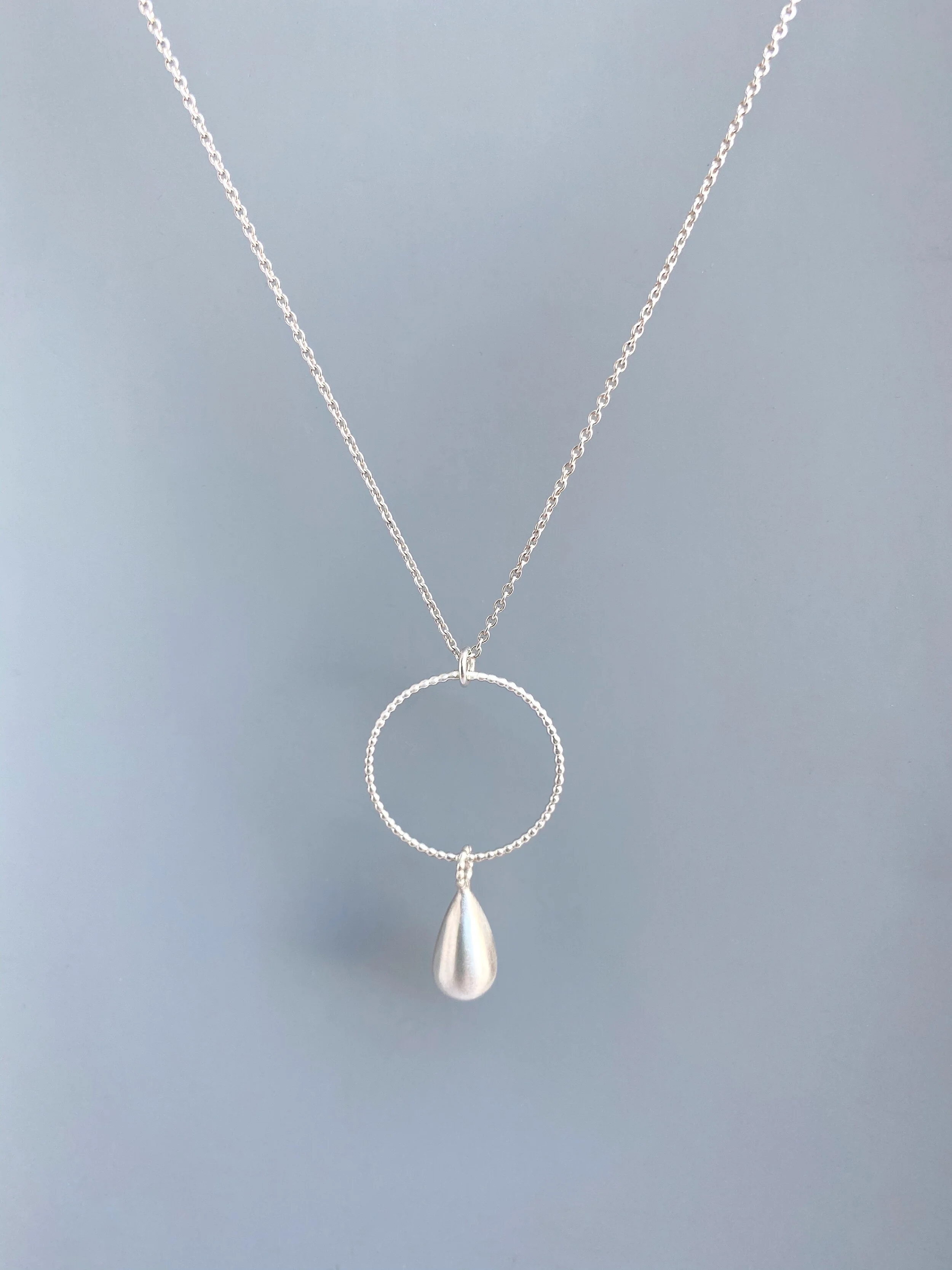 matte sterling silver teardrop pendant with granulated circle