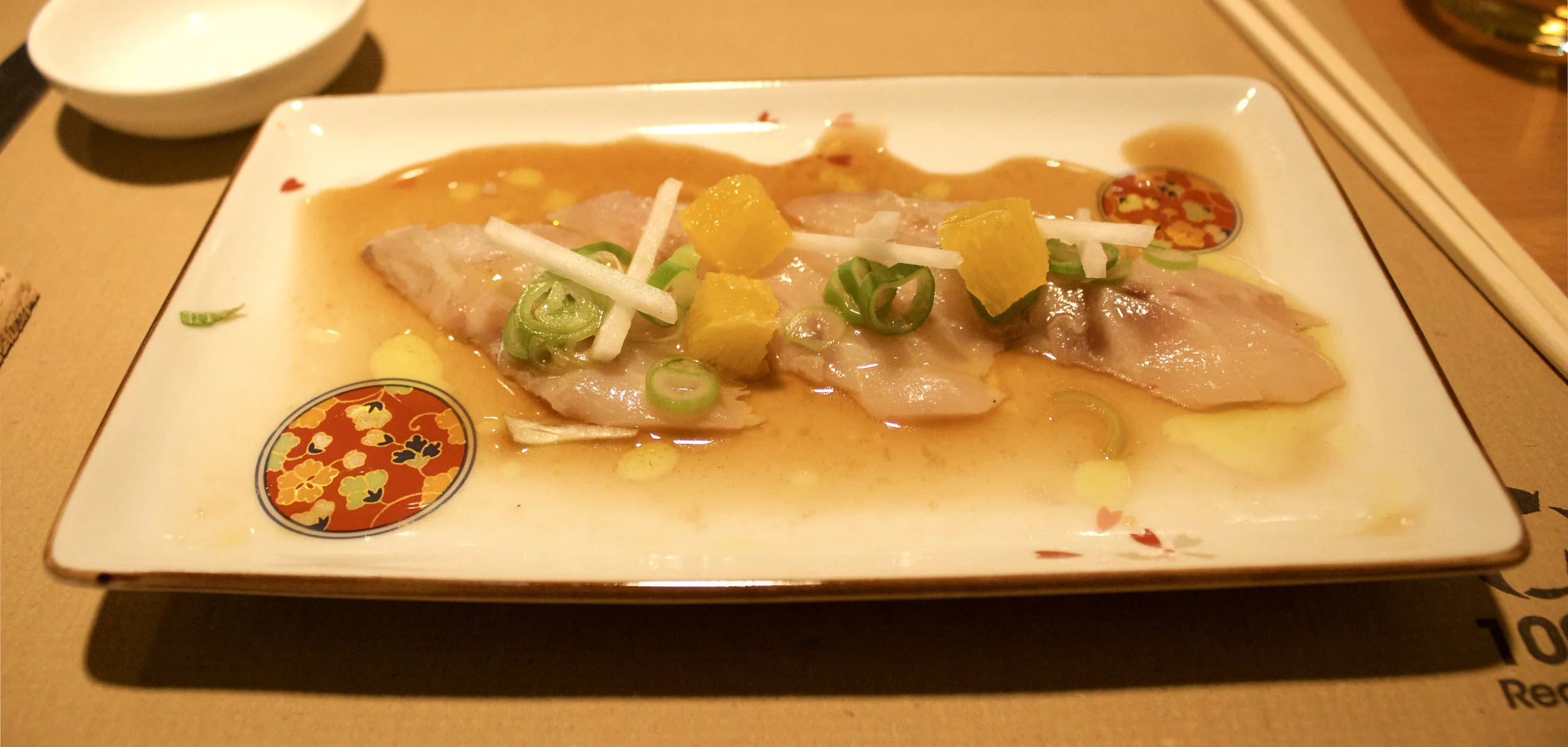 This is a sashimi dish, some ceviche influences there too I think!