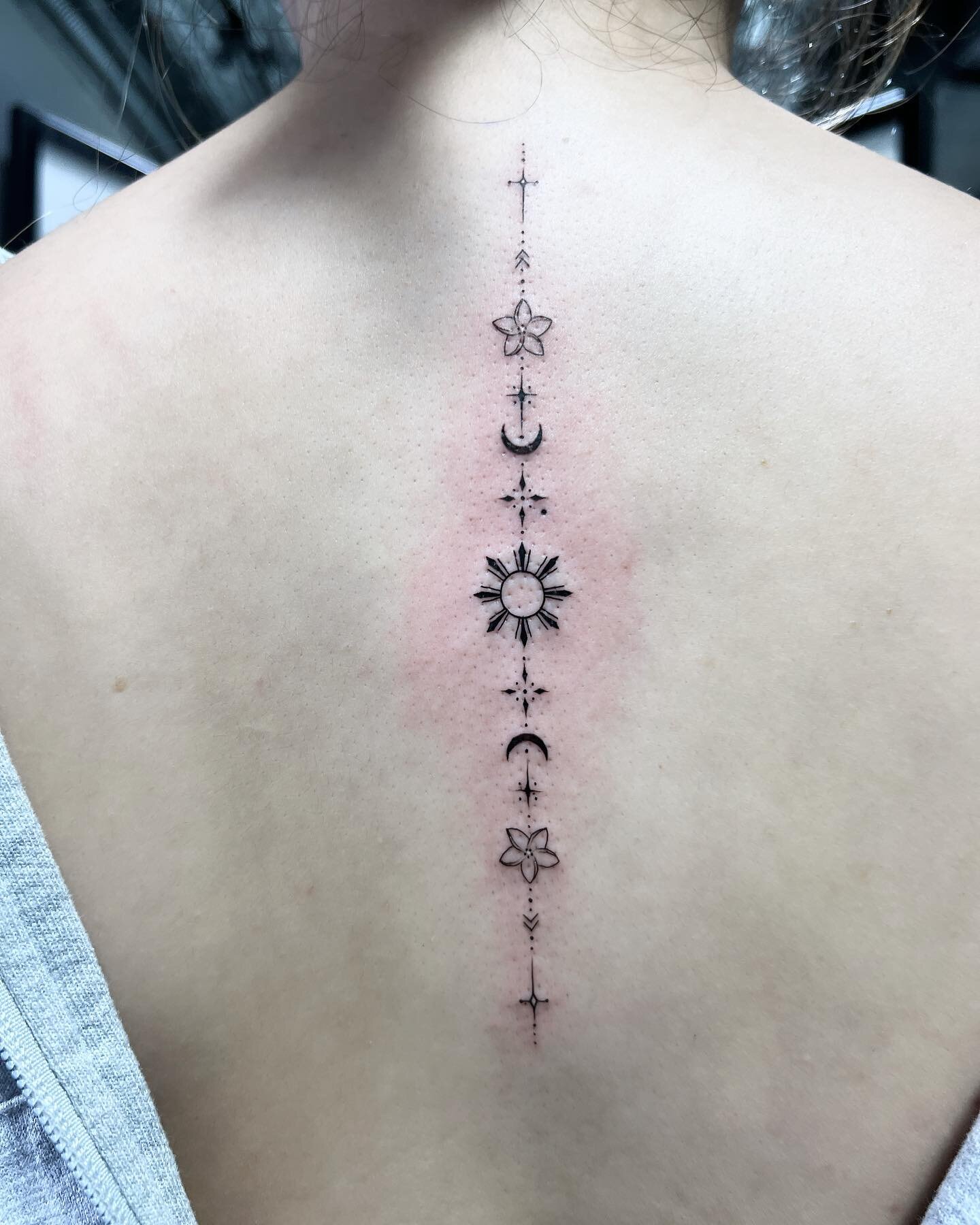 Philippines sun with a sported design along the spine. 
#spinetattoo #delicatetattoo #finelinetattoo #smalltattoo #finelines #nyctattoo #nyctattooartist #femaletattooartist #tattoos