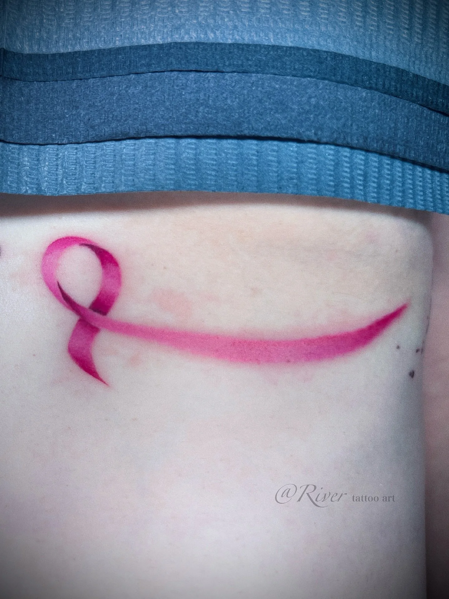 Pink ribbon &mdash; a symbol of strength and hope.
#NYCTattoo #FlushingTattoo #TattooArt #MinimalTattoo #RibbonTattoo #PinkRibbon #SymbolTattoo #FineLineTattoo #CustomTattoo #TattooForHope #StrengthAndResilience #TattooArtist #BodyArt #TattooDesign
