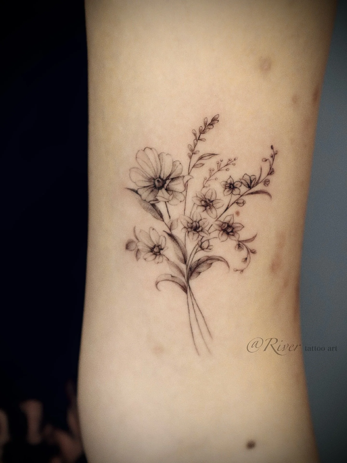 Birth flower bouquet for a little one&rsquo;s special month. 🌸 Fine line, delicate and timeless.

#FlushingTattoo #NYCTattoo #FineLineTattoo #FloralTattoo #BirthFlowerTattoo #CustomTattoo #DelicateTattoo #MinimalTattoo #InkNYC #TattooArt #birthdayfl