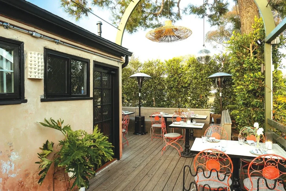 leuleu-patio-deck-orange-chairs-disco-ball.jpg