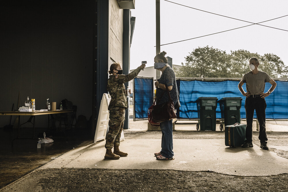  NYTSTORM - Lake Charles, LA - August 26, 2020 - Local residents gathered at the Burton Complex, an event center in Lake Charles, for assisted evacuation. The city of Lake Charles and members of the US military ran a joint effort to move citizens out