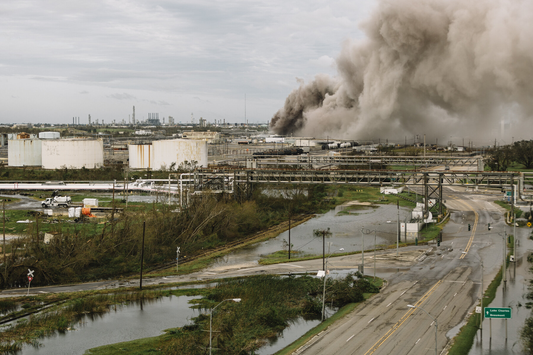  NYTSTORM - Westlake, LA - August 27, 2020 - A fire burned at a BioLab industrial site across the Calcasieu River from downtown Lake Charles. Hurricane Laura's high winds and storm surge had a devastating impact on downtown Lake Charles and the surro