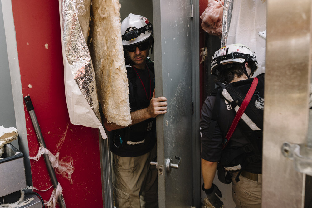  NYTSTORM - Lake Charles, LA - August 27, 2020 - Members of Empact Northwest, a non-profit search and rescue team based in Kingston, Washington search through a storm-damaged gas station after neighbors reported someone may have been trapped inside w