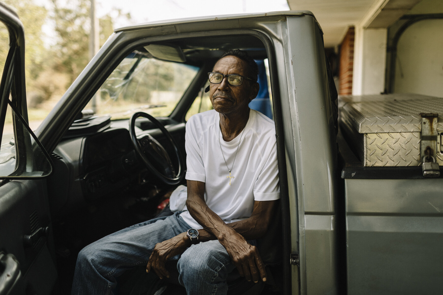  NYTSTORM - Lake Charles, LA - Oct. 11, 2020 - Lester Rubit sits in his truck, which was smashed by a collapsed hotel walkway during Hurricane Laura. Lake Charles was hit hard by Hurricane Laura earlier this fall, and barely had a chance to begin the