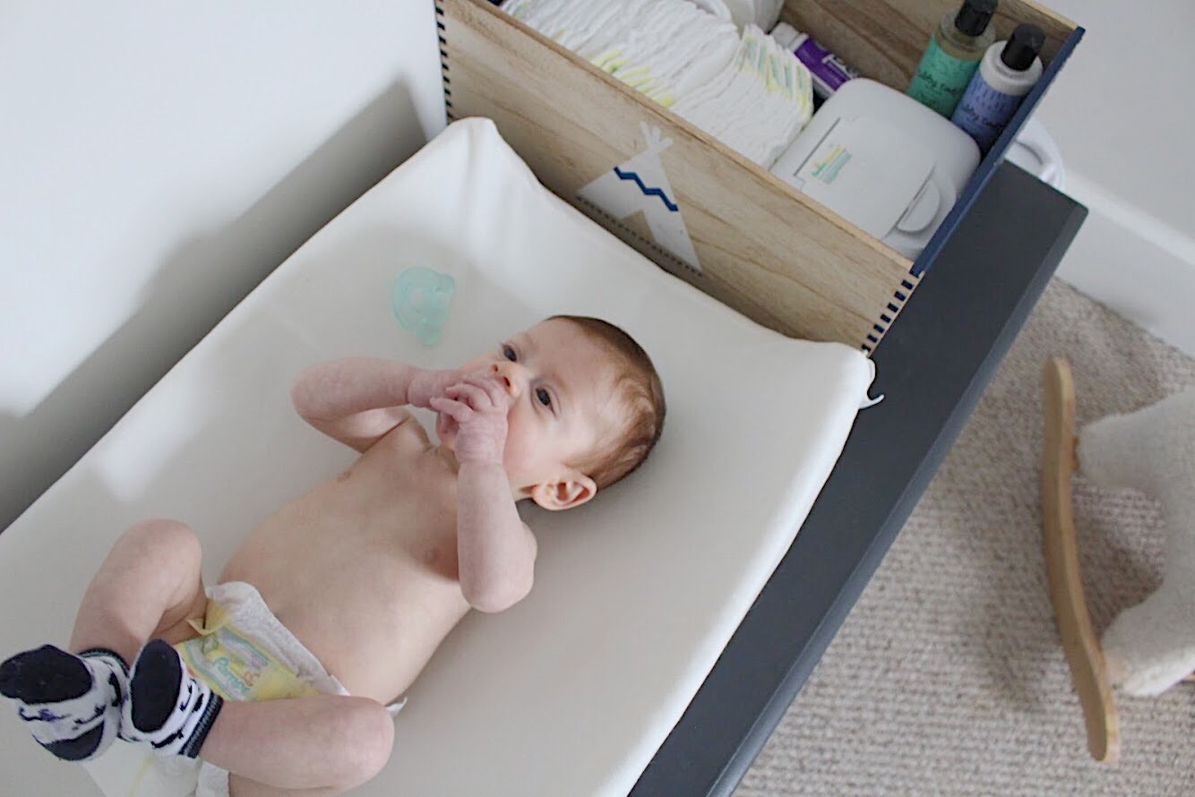baby on changing table