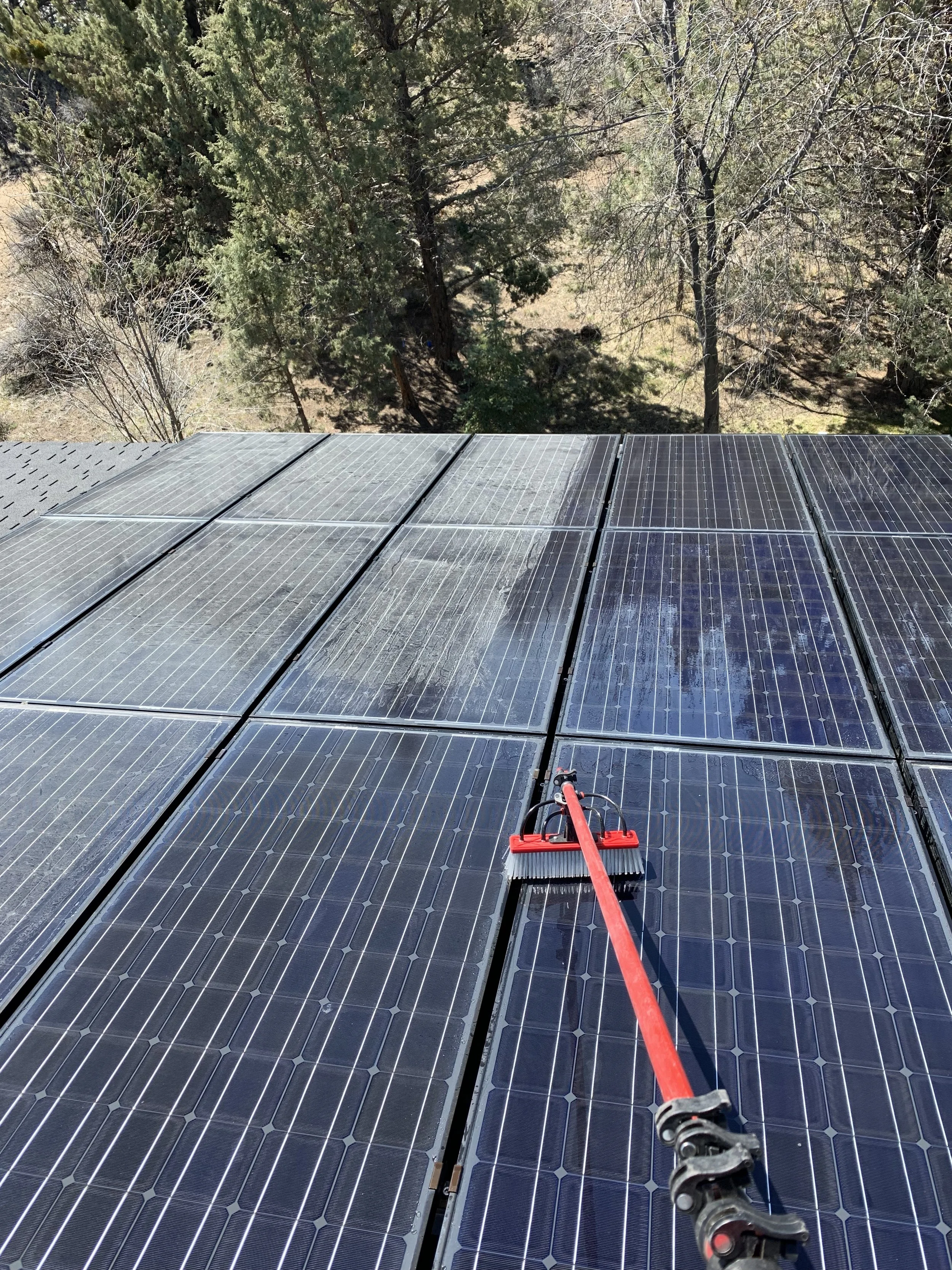 Rooftop view of a Bend, Oregon home during professional solar panel and gutter cleaning service.