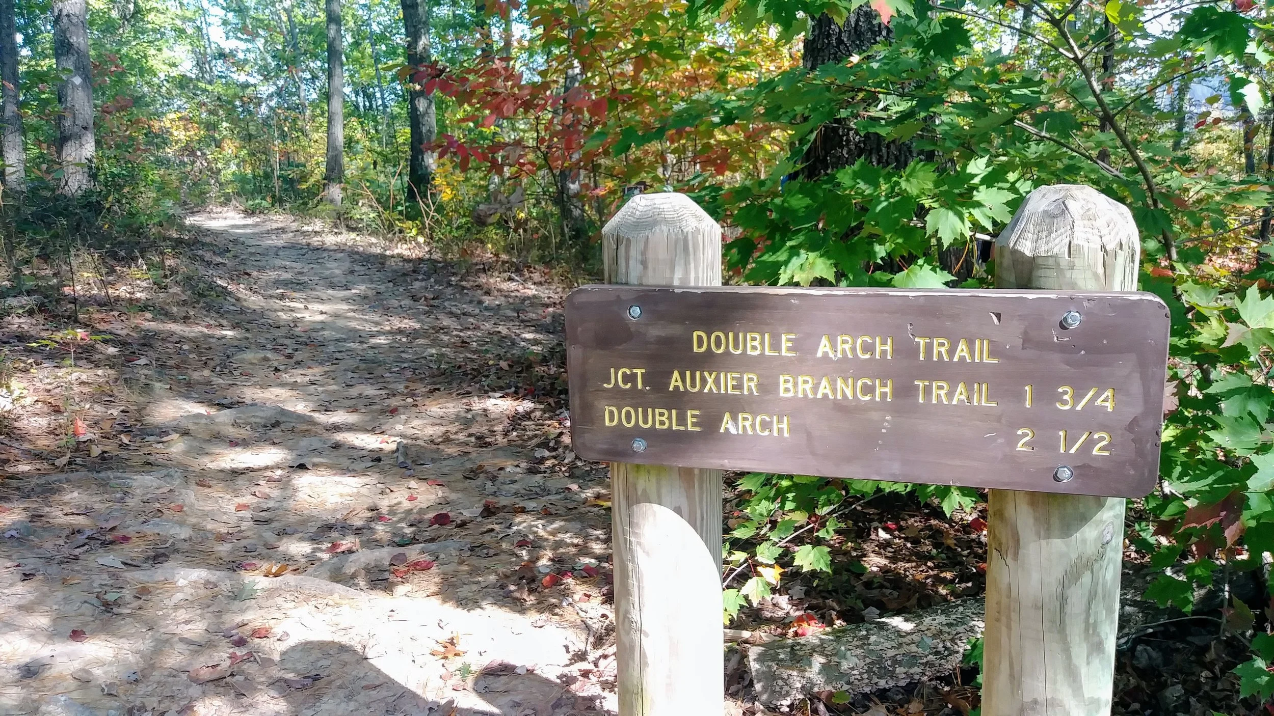 Signs at the Double Arch Trailhead.