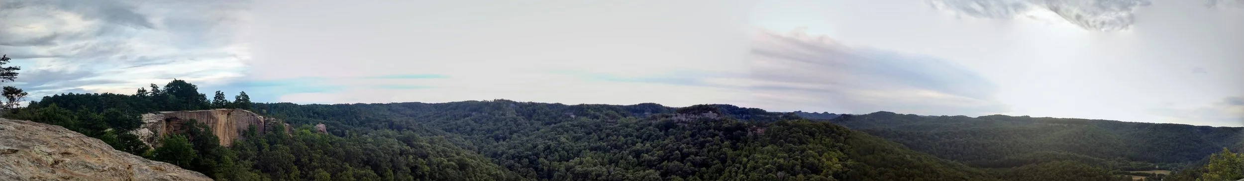 A full 180-degree view from Auxier Ridge looking out to Double Arch (center) and Red River Gorge (right)