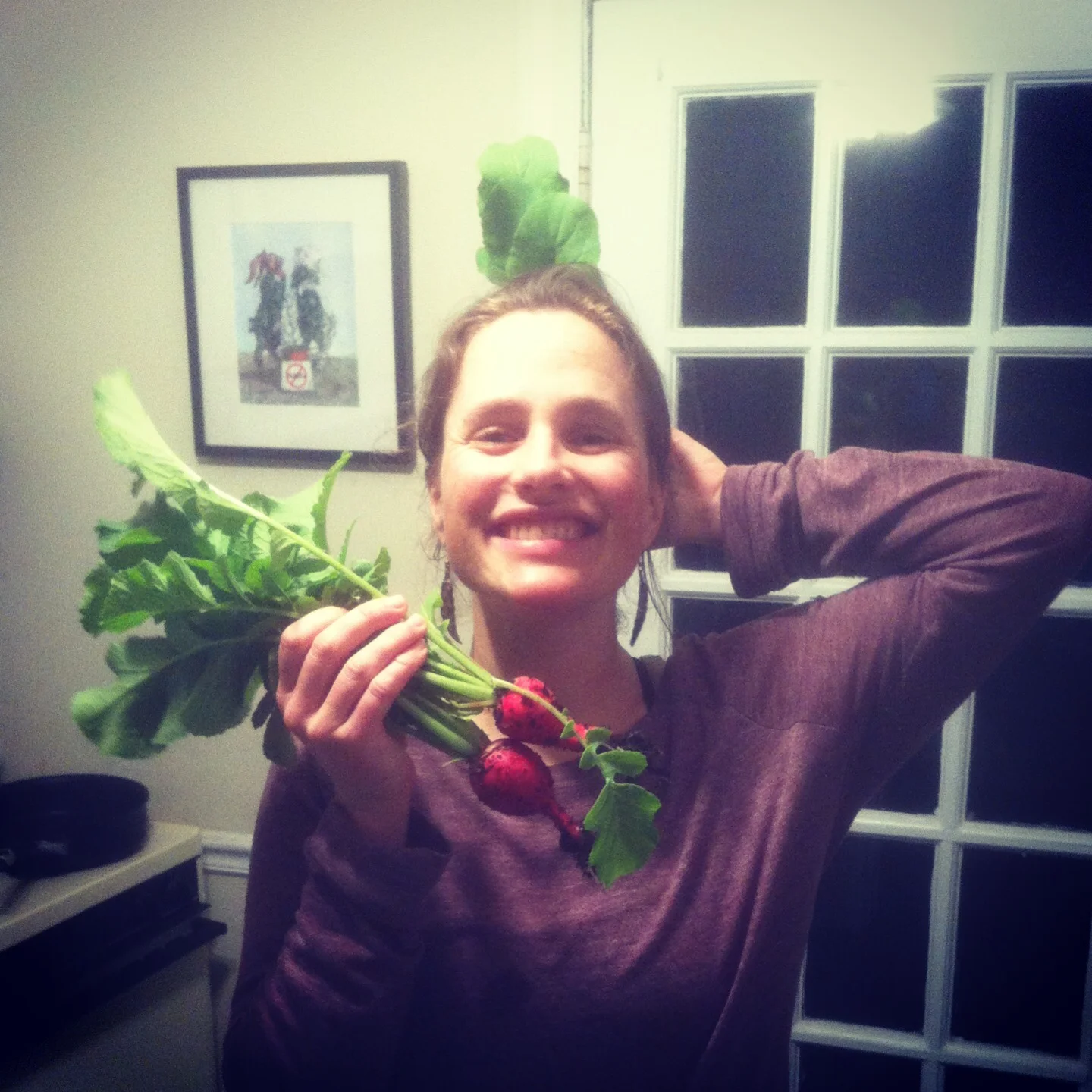  Treats from our first raised garden bed decorate our wellness practitioner and educator, Jenn. 