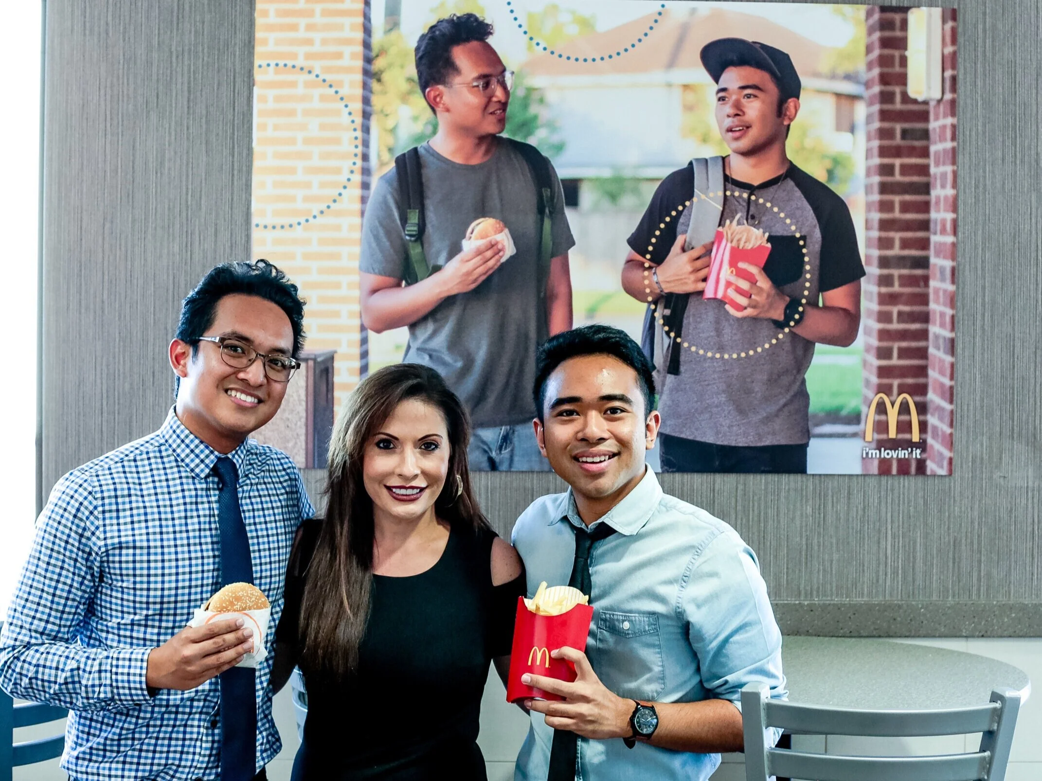 Photo_Christian+Toledo+and+Jehv+Maravilla+with+McDonald%27s+owner+operator+Mariselle+Quijano+in+front+of+their+poster+at+McDonald%27s_Courtesy+of+McDonald%27s+Houston+%281%29.jpg