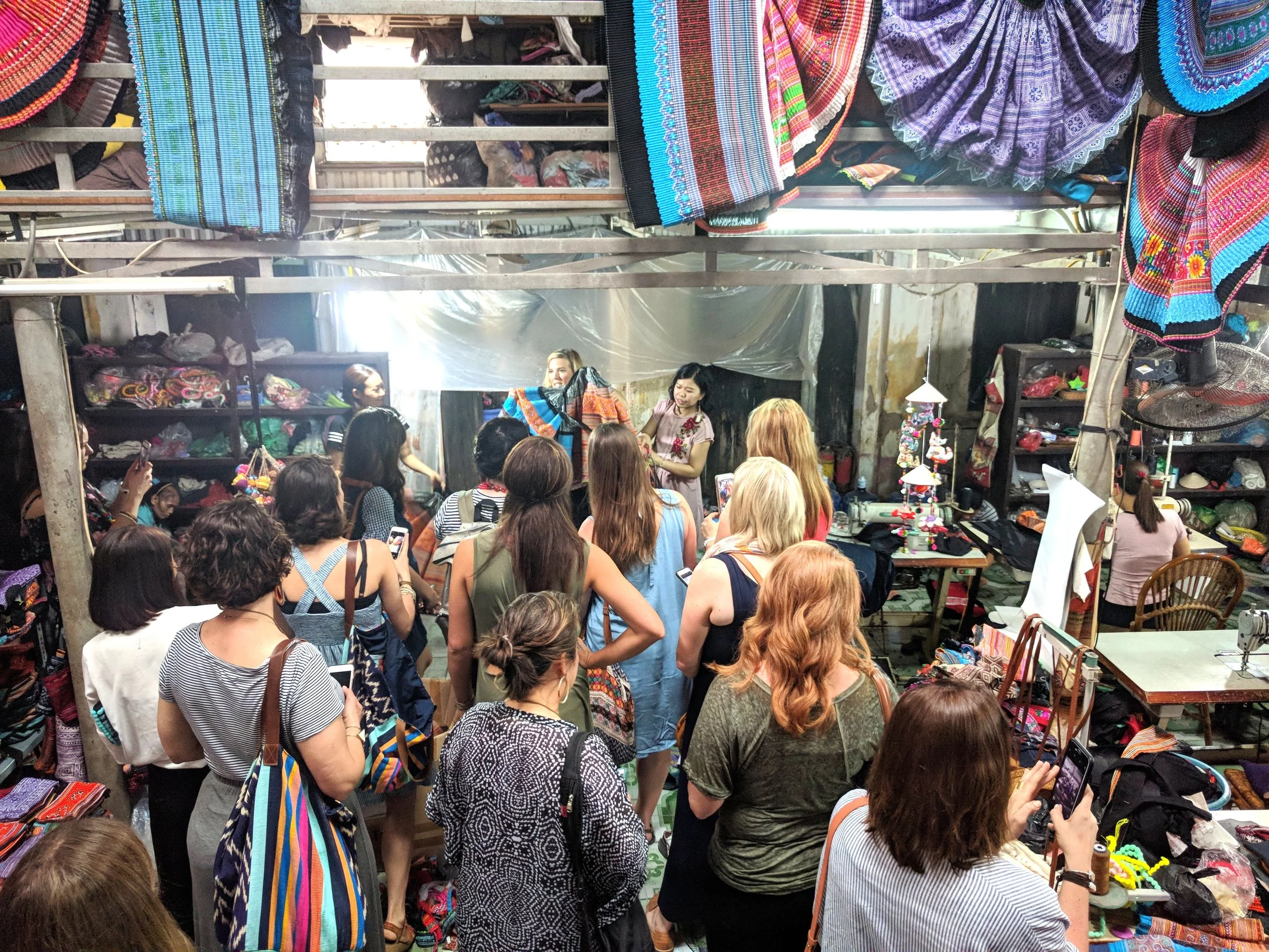 Hien’s workshop was full of Hmong skirts waiting to be repurposed, and shelves full of finished items that we could purchase - which we gladly did.