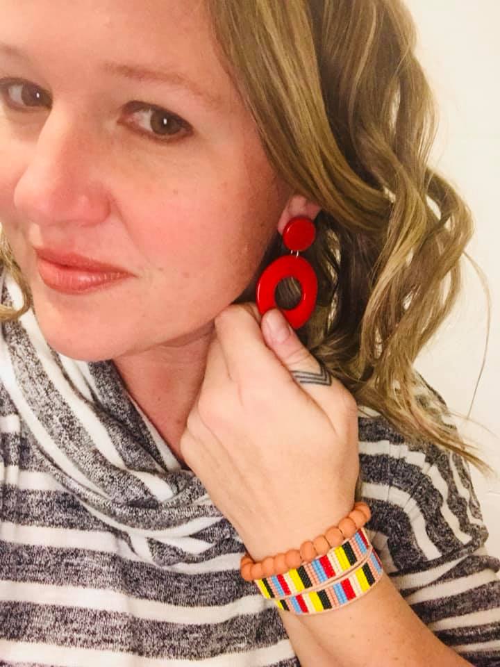 Lindy Zepp says, “I sometimes skip a necklace (especially with a neckline like this) and do statement earrings and an arm party.” The Orbital Earrings look awesome with the color blocking of the Banded Beads Wrap Bracelet and Terracotta Tassel Bracelet.